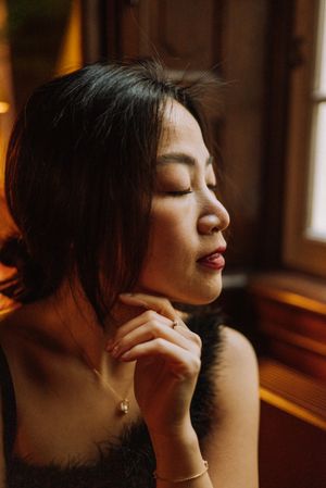 Sensual portrait series with warm lighting showcasing elegant poses and emotional expressions.