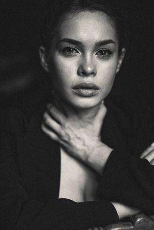 Dramatic black and white close-up portraits with strong contrast and shadows.