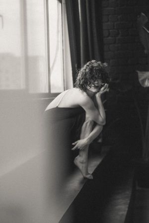 Dramatic black and white photo sequence showing movement and shadows near a window.