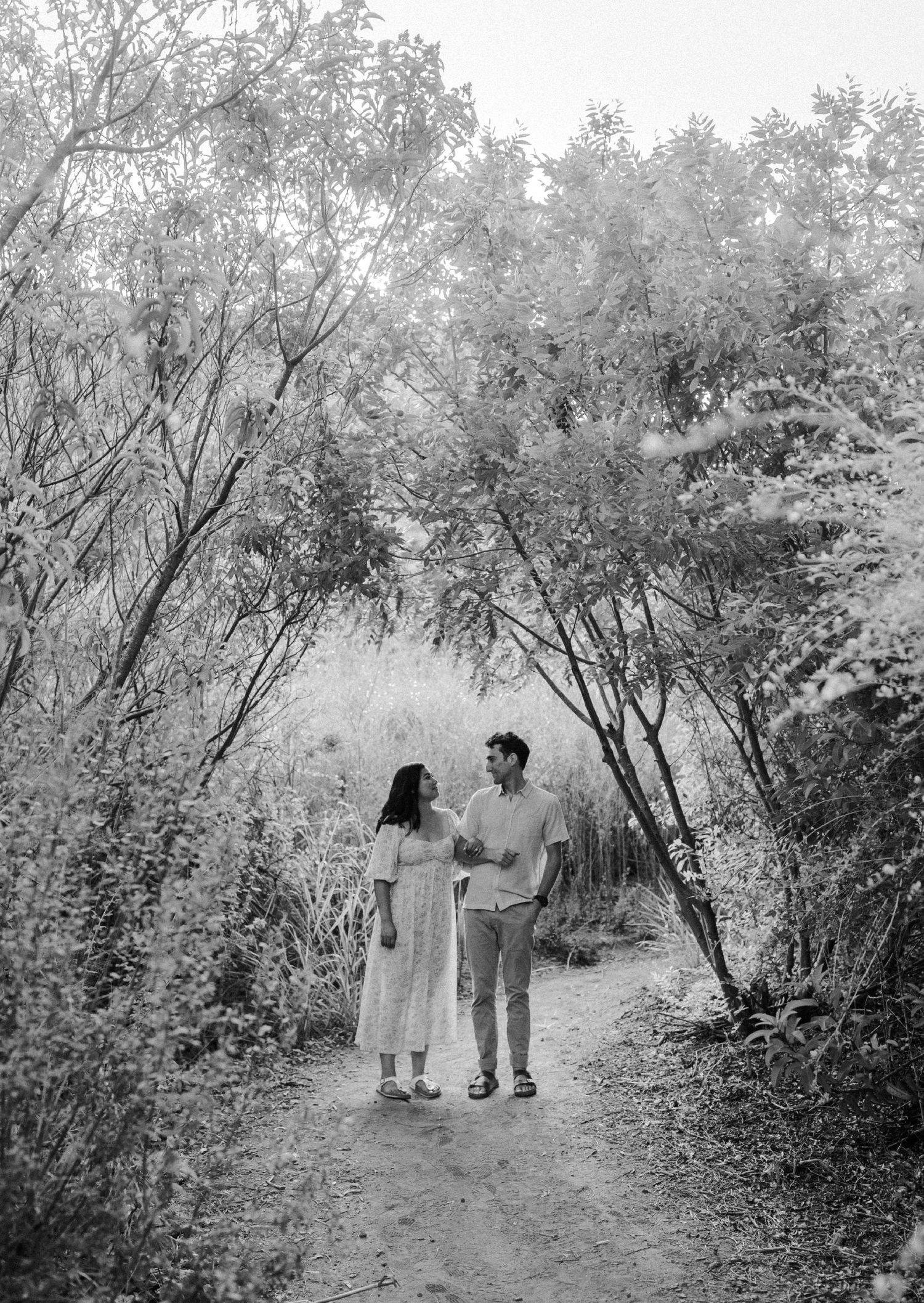 E. Noelle Photography couple engagement in the Los Angeles Malibu hills casual pose in front of tree