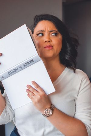Candid shots showing playful interactions with white envelopes and bright lipstick.