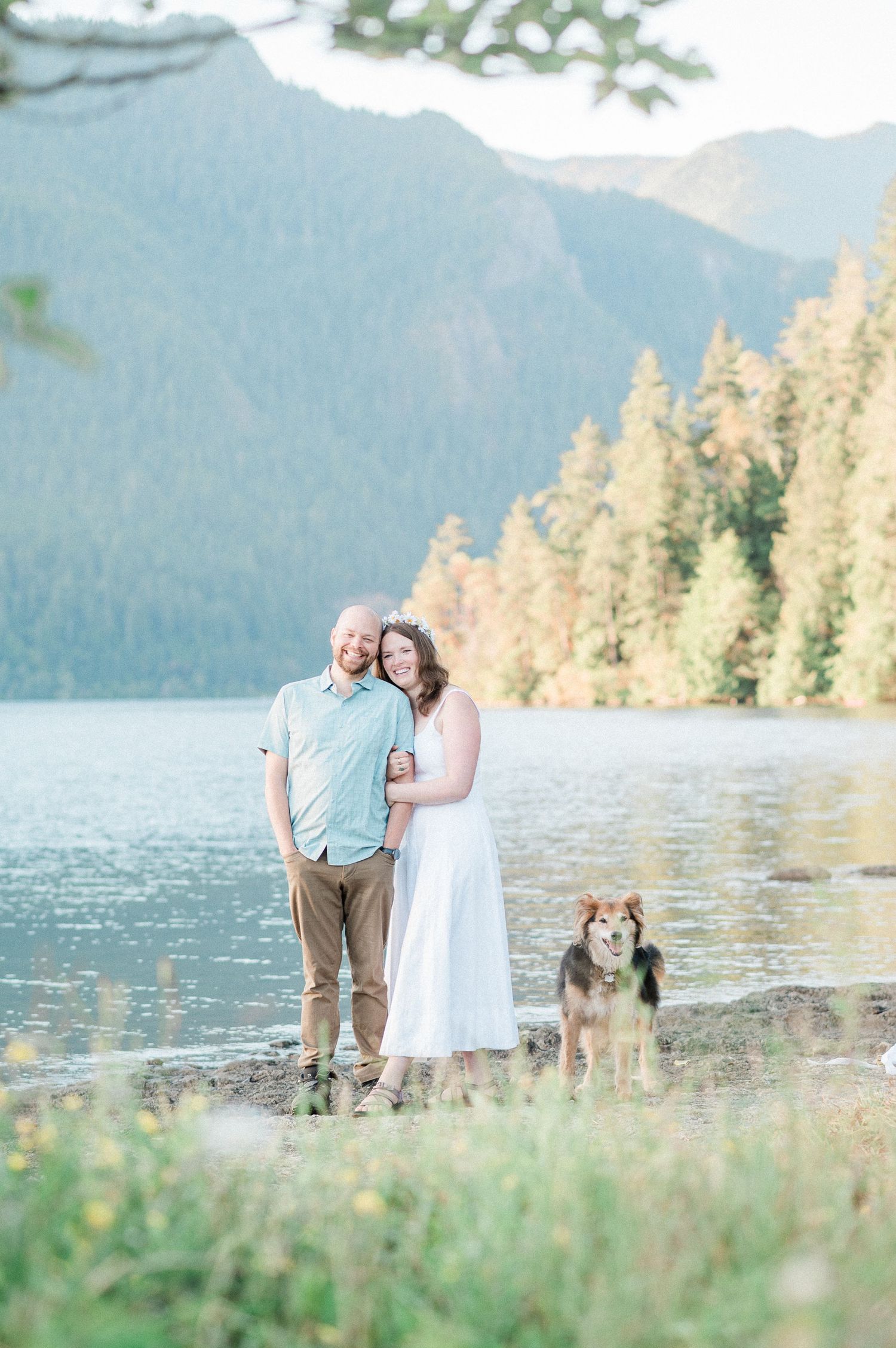 Newly married couple at Lake Crescent with dog. Photo by Washington Elopement photographer.