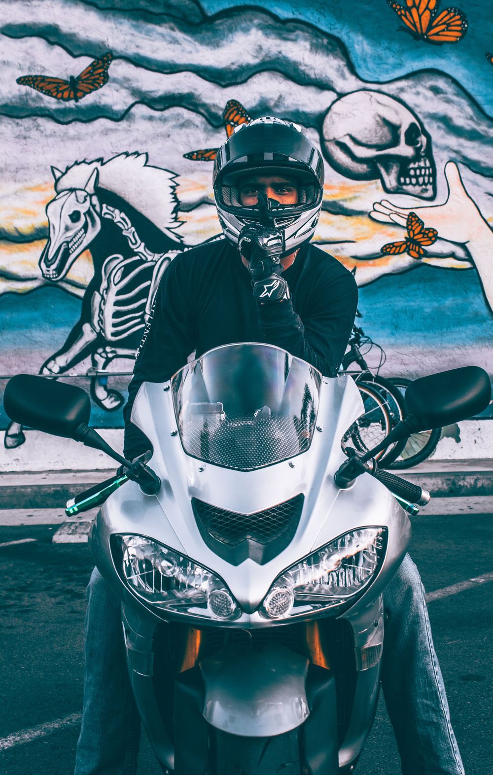 Man Shushing While on Motorcycle