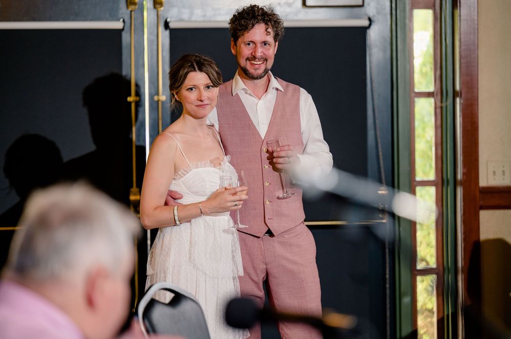 A couple shares their first toast during an intimate wedding celebration.