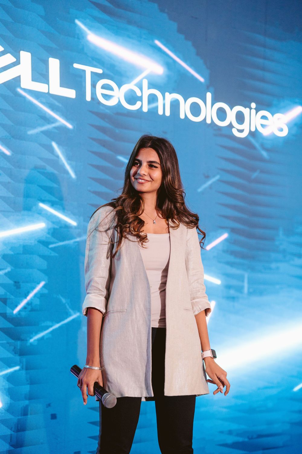 Professional presentation with glowing blue technology backdrop and company branding.