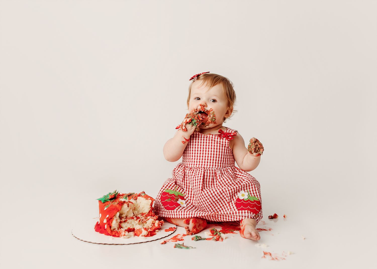 strawberry-theme-cake-smash-baby-girl-eating-cake