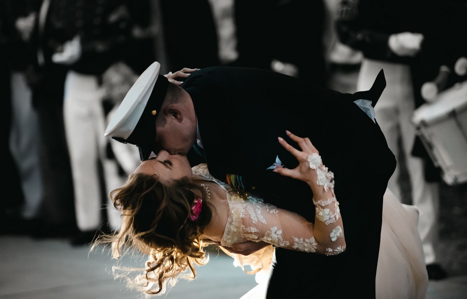Groom tips Bride and embraces her with a kiss evoking the ionic V-J Day Kiss in Times Square on August 14th 1945