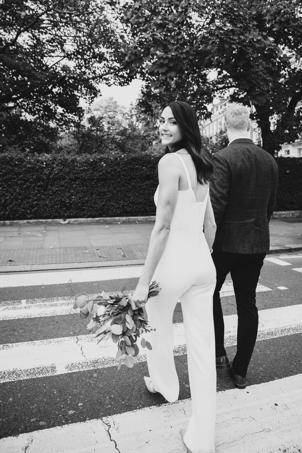 bride and groom in chelsea london crossing road