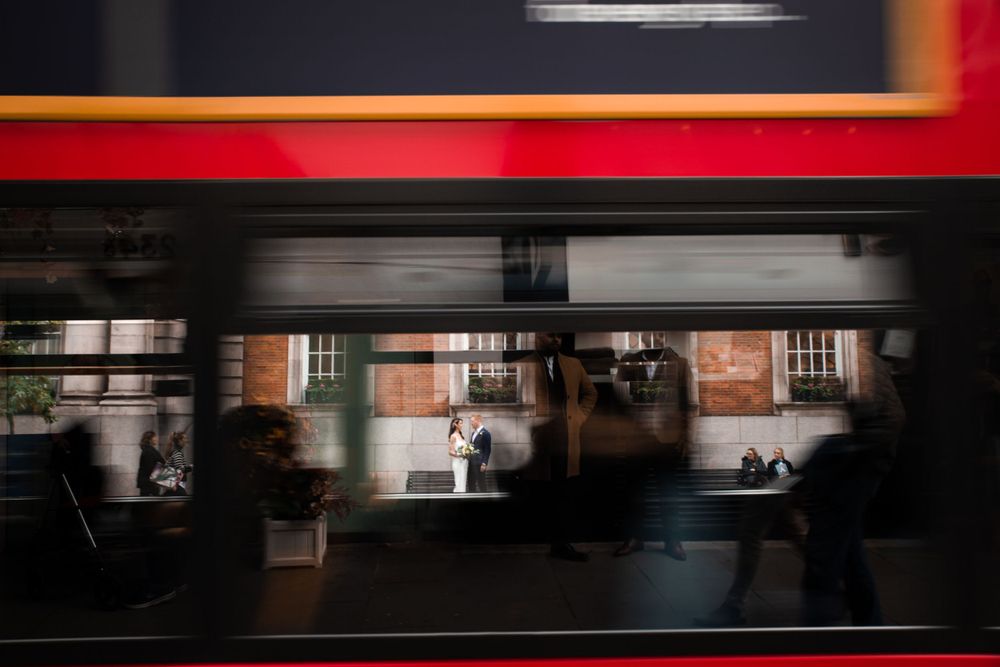 bride and groom in chelsea london and london bus