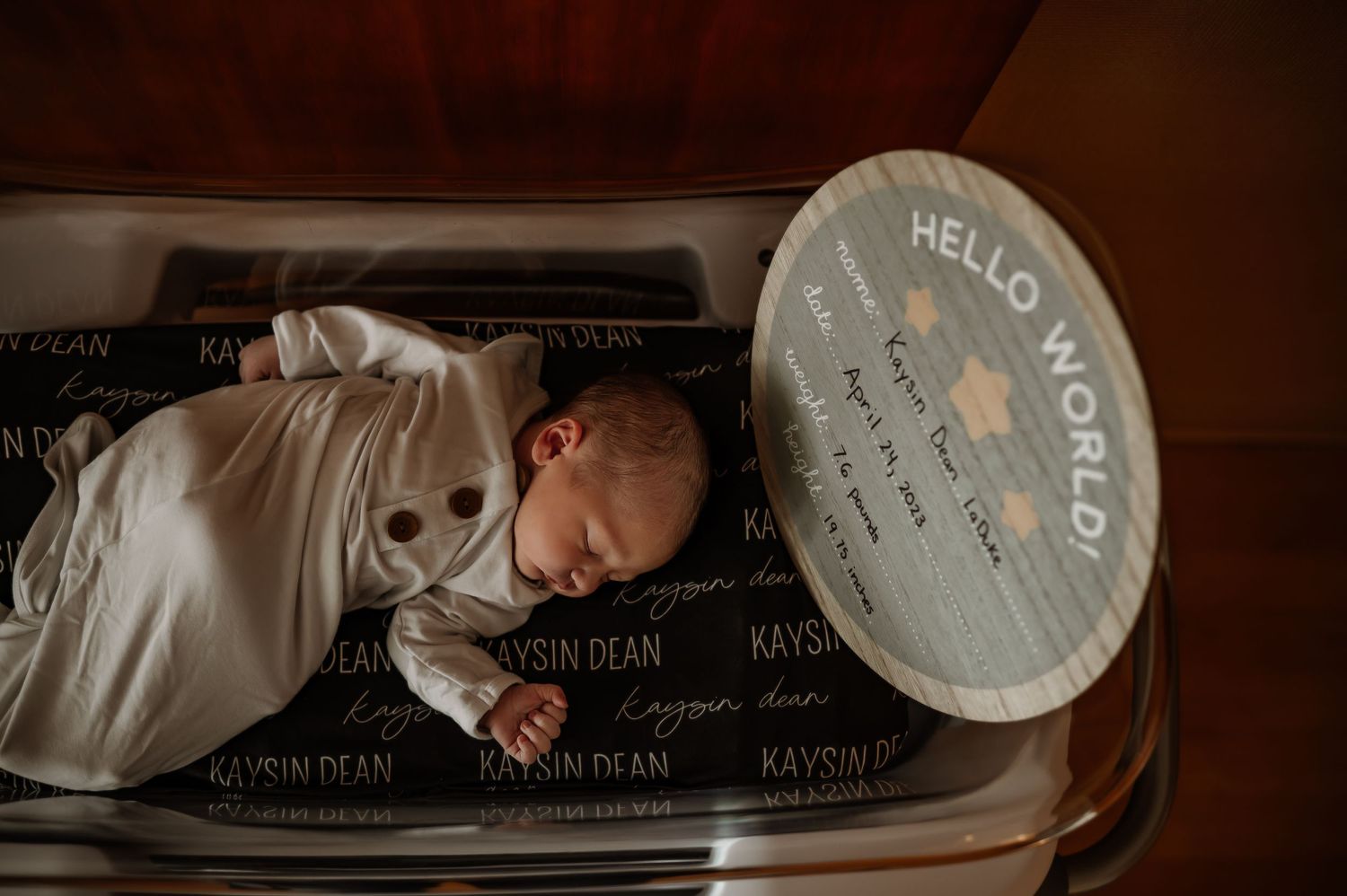 Intimate newborn photography session with soft brown tones and text overlay.