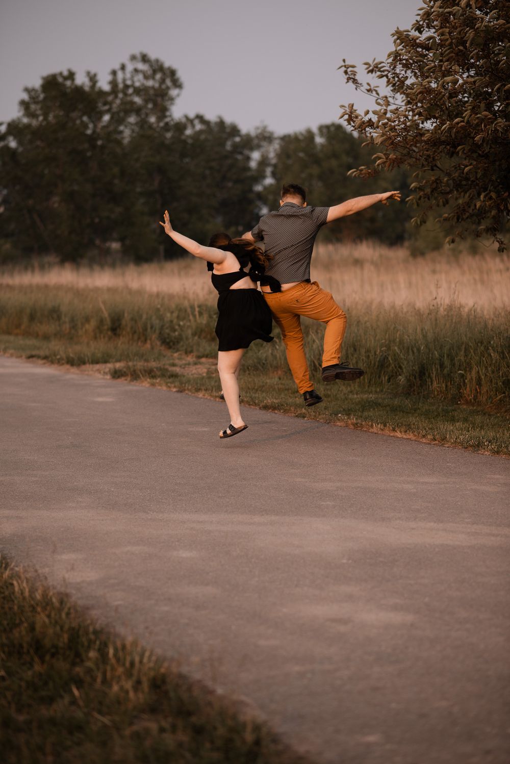 Playful couple photography session during golden hour in Buffalo NY