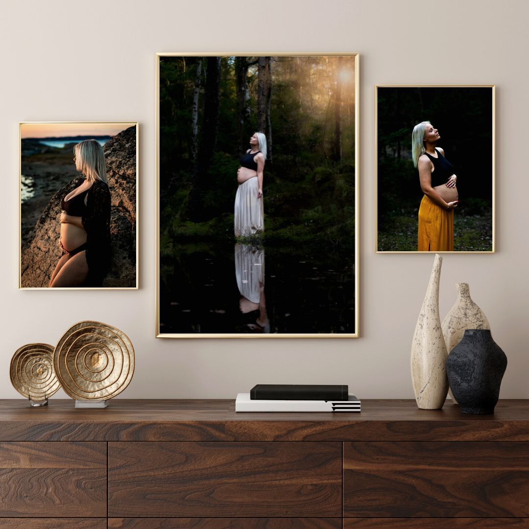 Gallery wall display featuring artistic portrait photographs in wooden frames with decorative accessories.