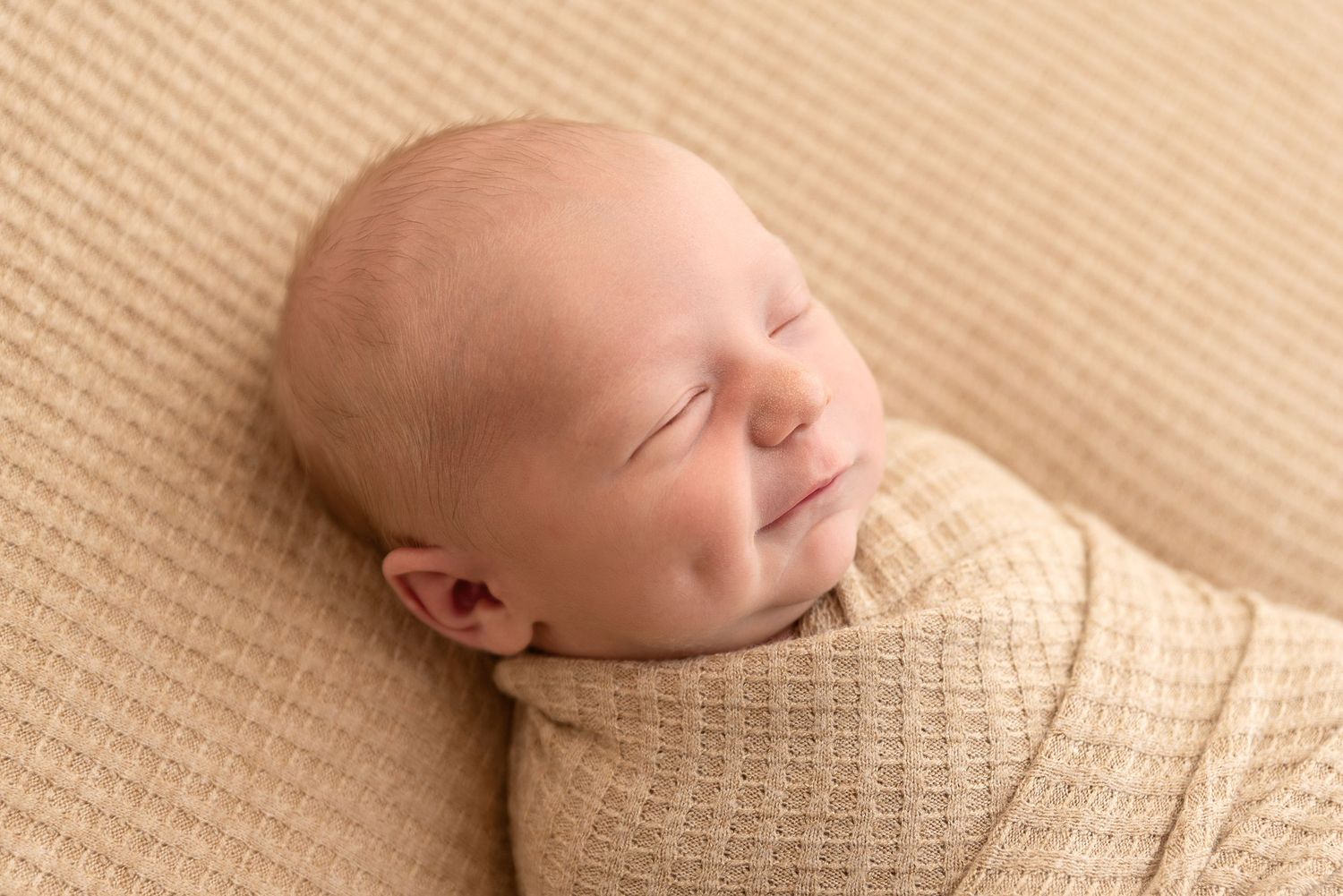 newborn smile boy