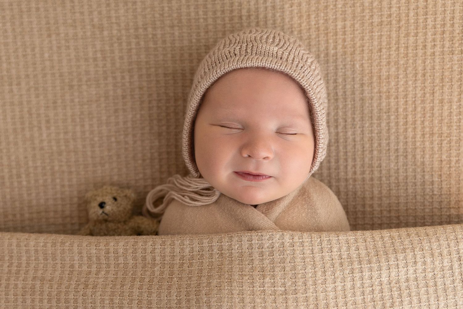 newborn boy smile