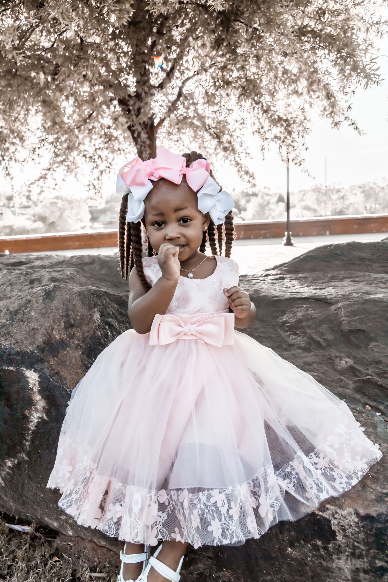 The littlest one ruling the show at a family Easter session in Columbus Georgia Riverwalk