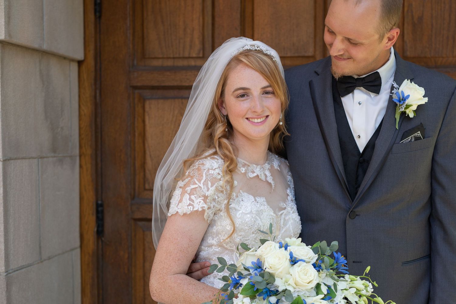 bride and groom outside church doors Canton, OH