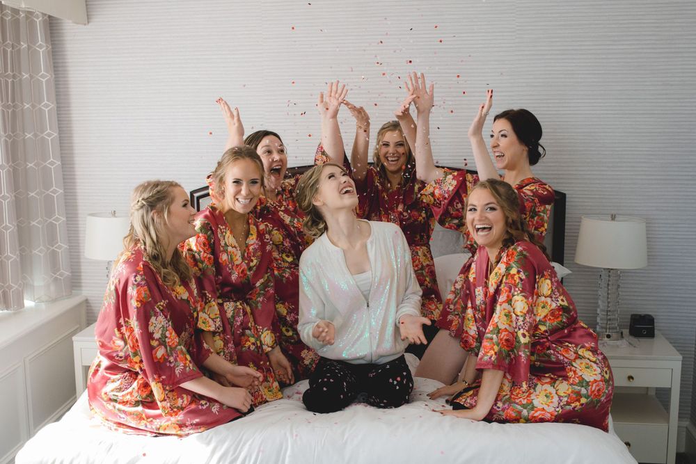 Cherished moments from a Milwaukee wedding: confetti shot of bride and her girlfriends
