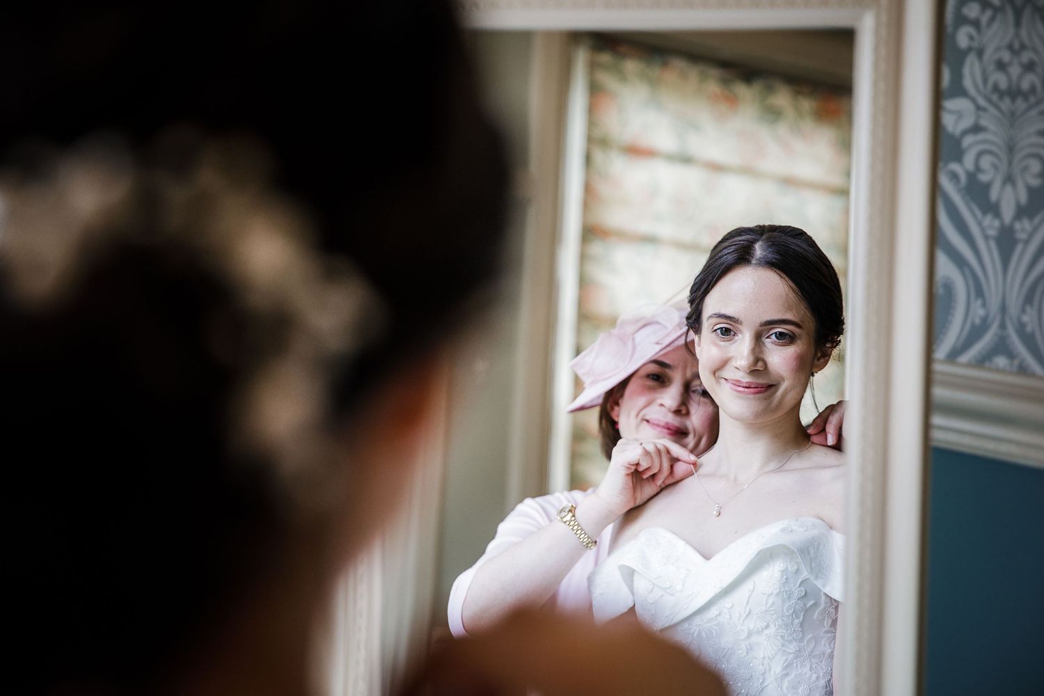Bride getting ready in dressing room at Kelham House