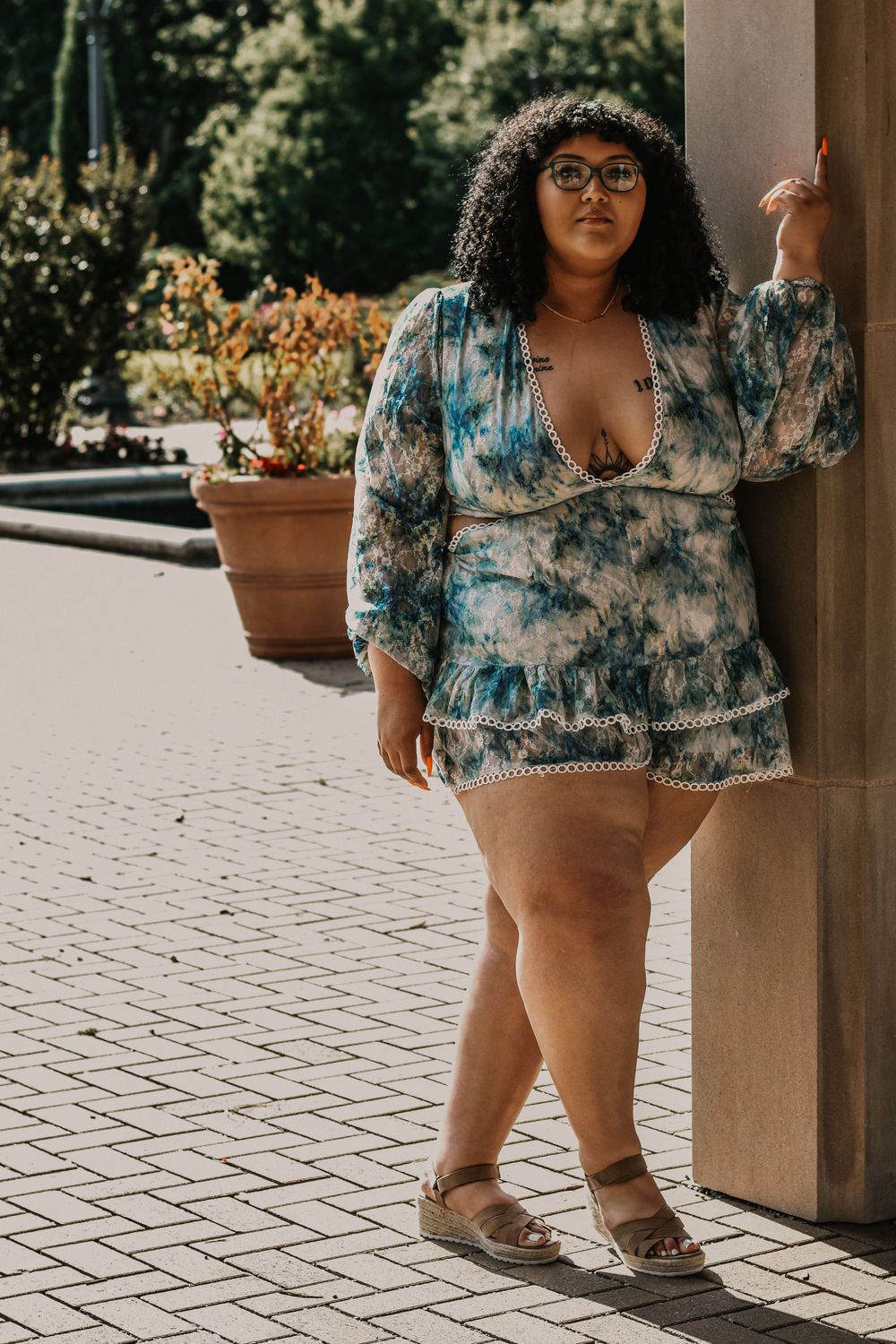 A gorgeous plus-size woman poses for photos