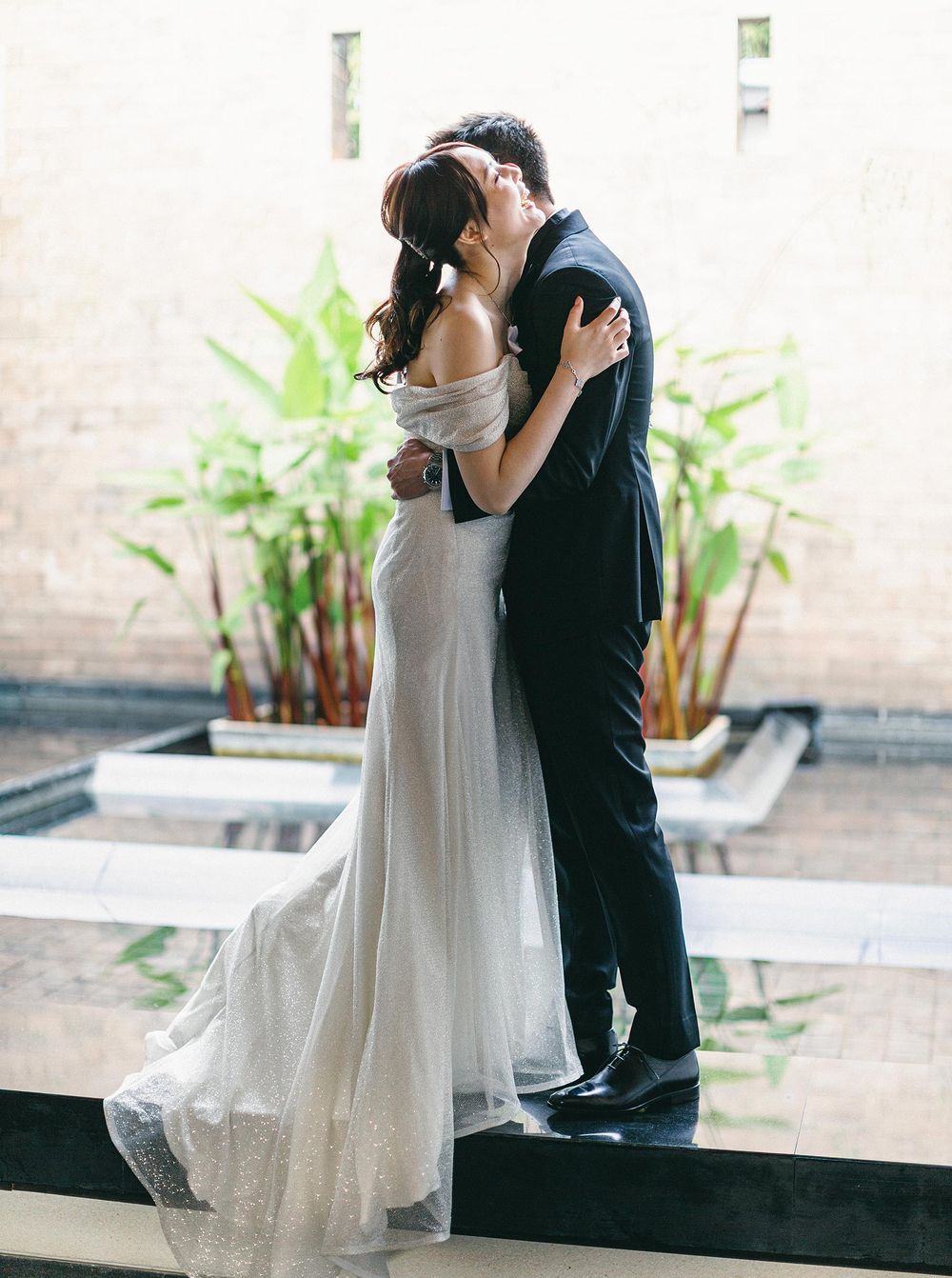 A bride and groom sharing a first look moment in Phuket, Thailand, captured by a wedding photographer in Thailand.