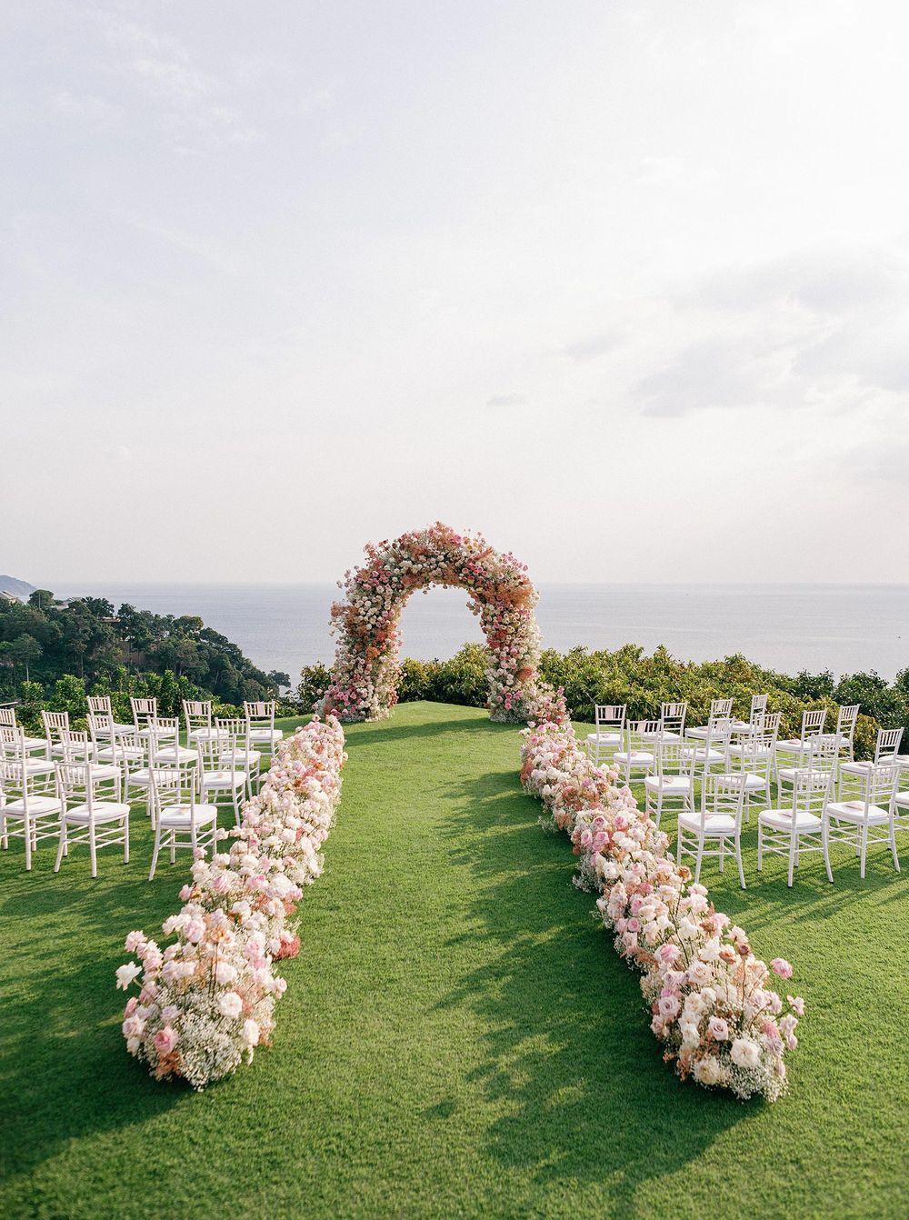 Wedding ceremony at the cliff in Phuket, Thailand - a luxurious celebration of love by the sea.