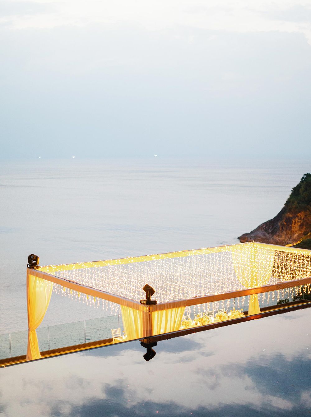 A rooftop wedding reception at Paresa Resort in Phuket, Thailand, with a breathtaking ocean view.