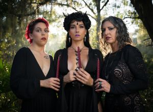 Artistic outdoor portrait series showing people in dark clothing against a mystical forest backdrop.