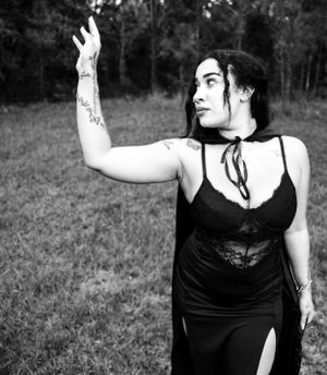Black and white portrait series showcasing elegant gothic-inspired fashion poses.