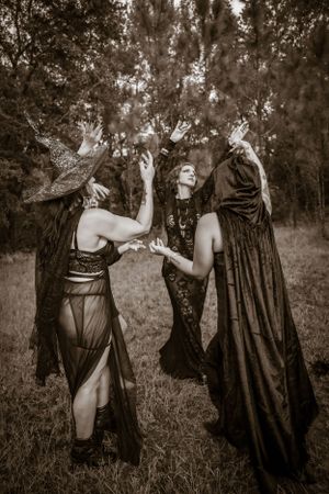 Artistic black and white series showing ethereal dance movements in a dreamy outdoor setting.