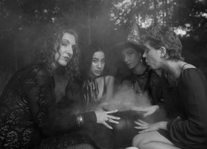 Moody black and white photograph with smoke effects and dramatic lighting.