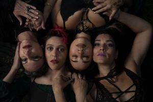 Creative overhead photography with dramatic black clothing and styling.
