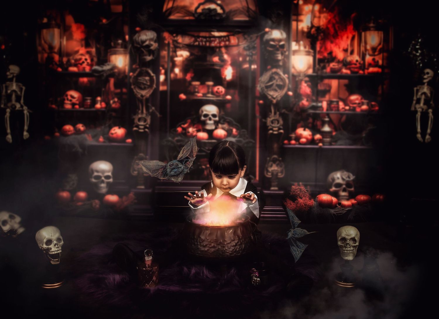 Atmospheric Halloween setup with glowing cauldron, skulls and pumpkins in dark moody lighting.