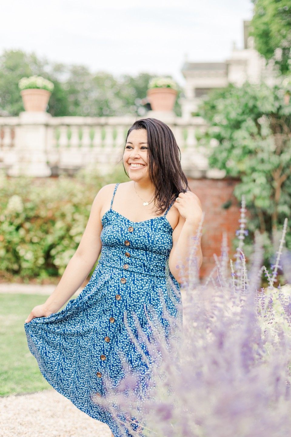 Hudson Valley, NY family photographer Danielle Lauren Photography in blue dress next to lavender in a garden
