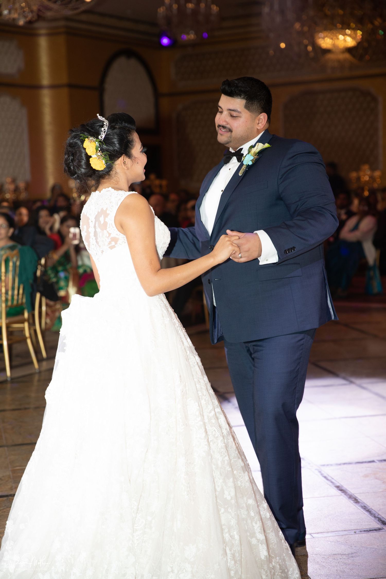Beutiful photo of Bride and Groom dancing to a meaningful song during first dance at wedding reception.