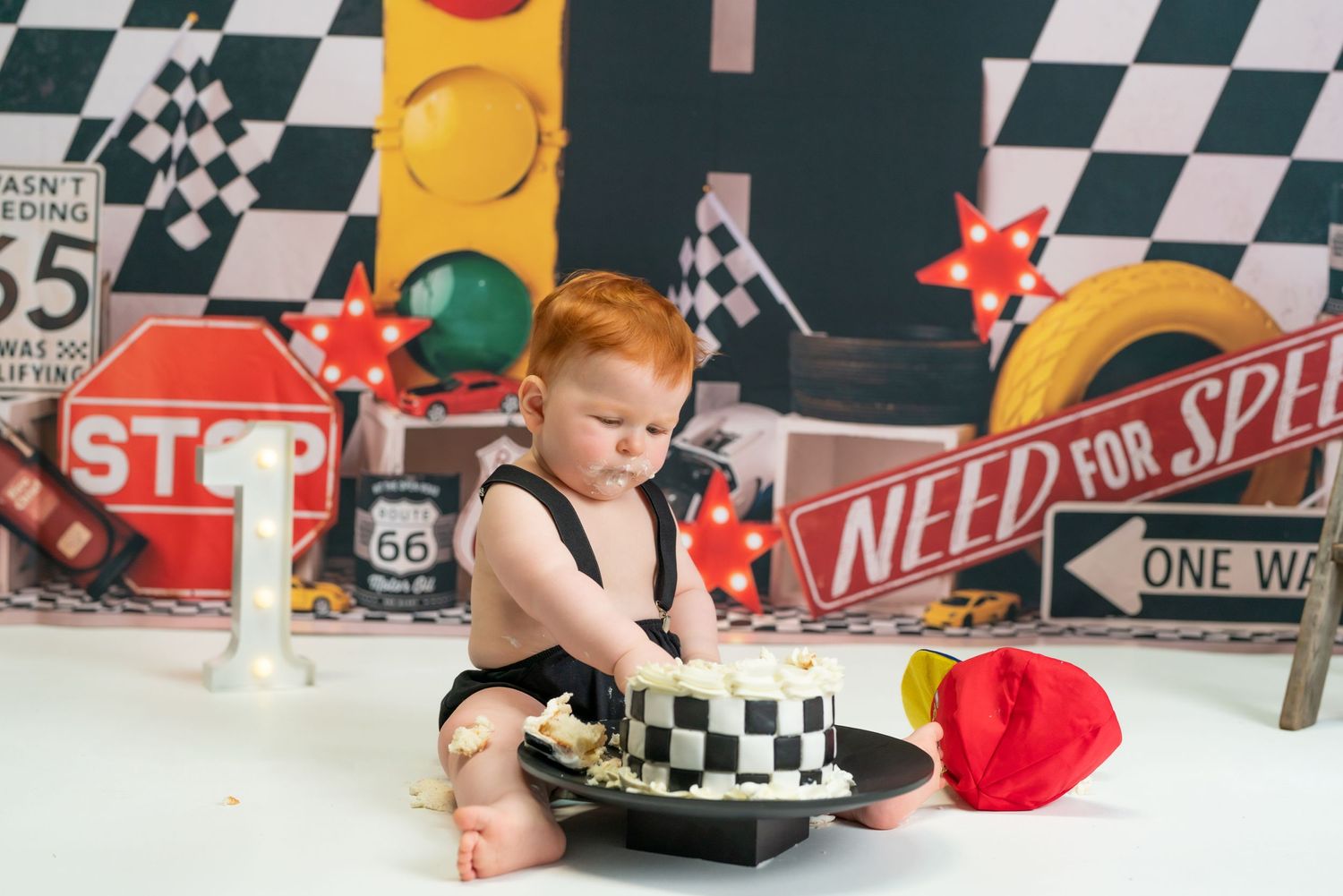 Fast One Cake Smash 1st birthday cake smash session in a Bothell studio. Fun, authentic birthday photography Filling the Frame Photography