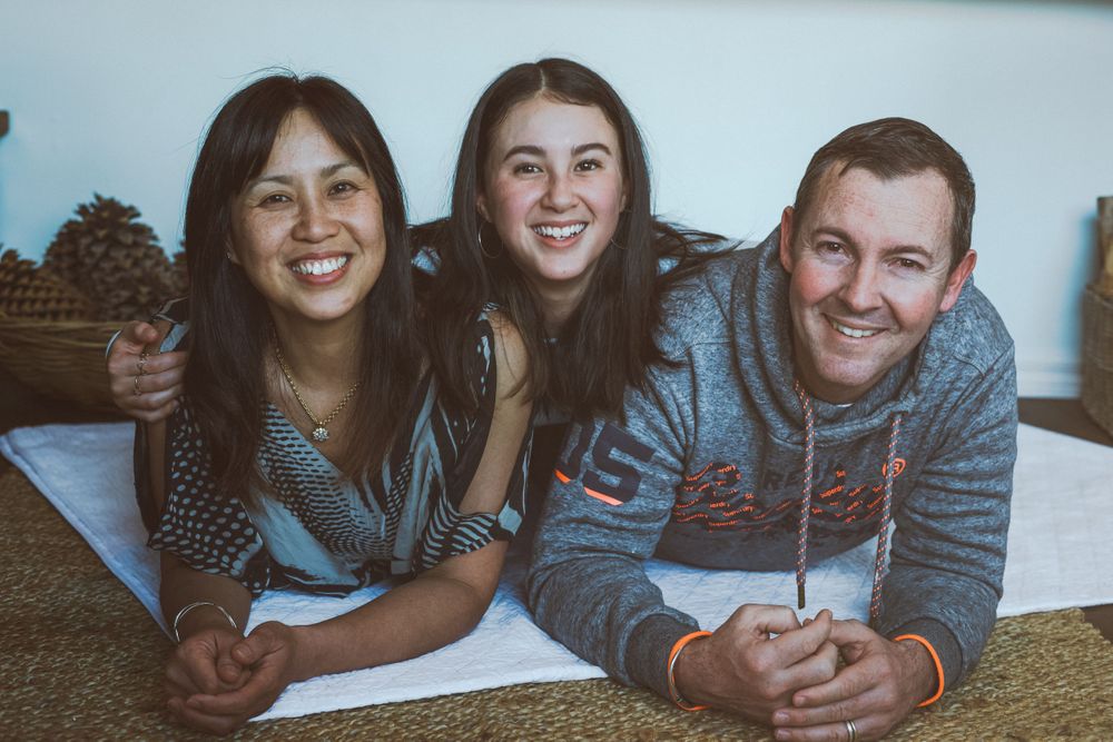 Happy and smiling family of three
