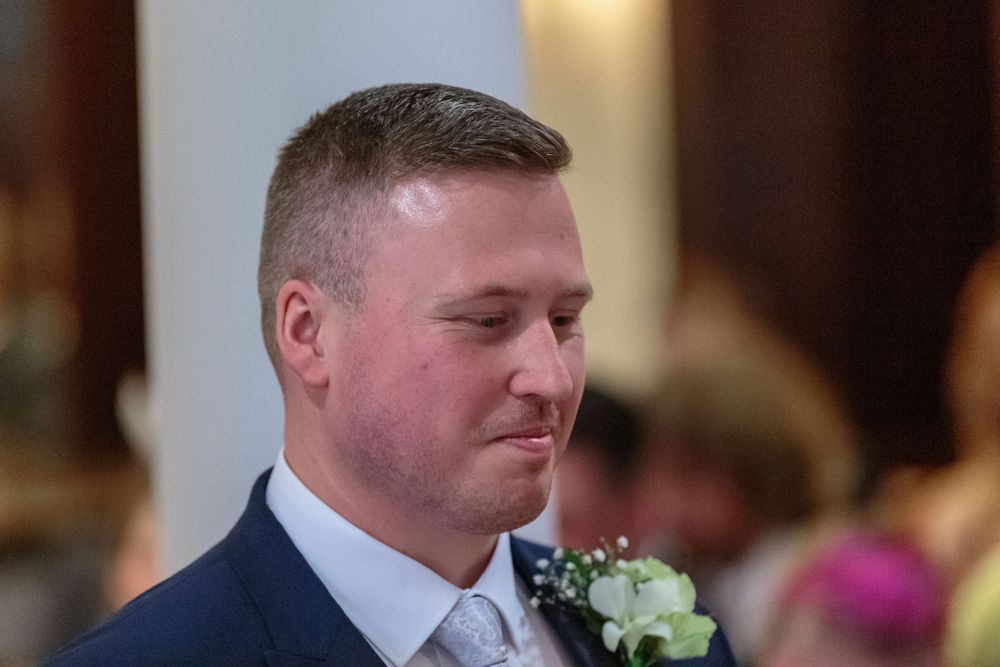 groom smiling at the registrars mistake