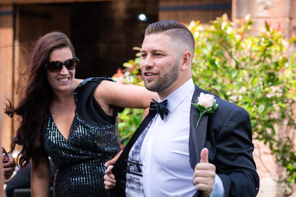 Celebratory moment captured during outdoor wedding festivities.