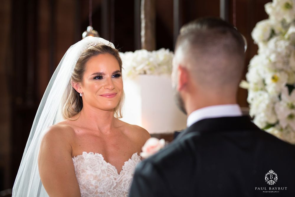 An intimate exchange between the bride and groom during their wedding ceremony.