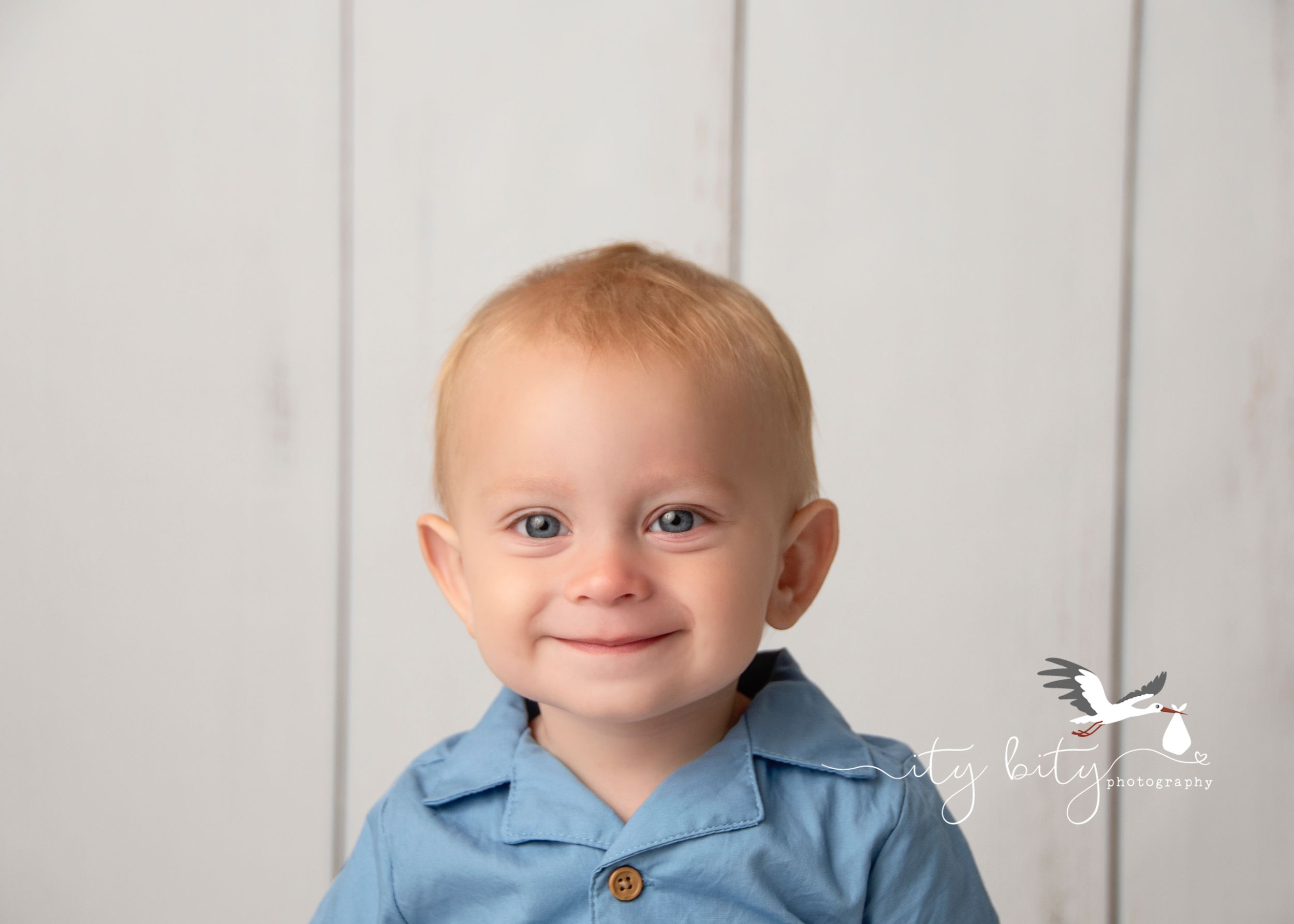 The cutest smile on One Year Liam during his cake smash session at Ity Bity Photography in Avon Ohio