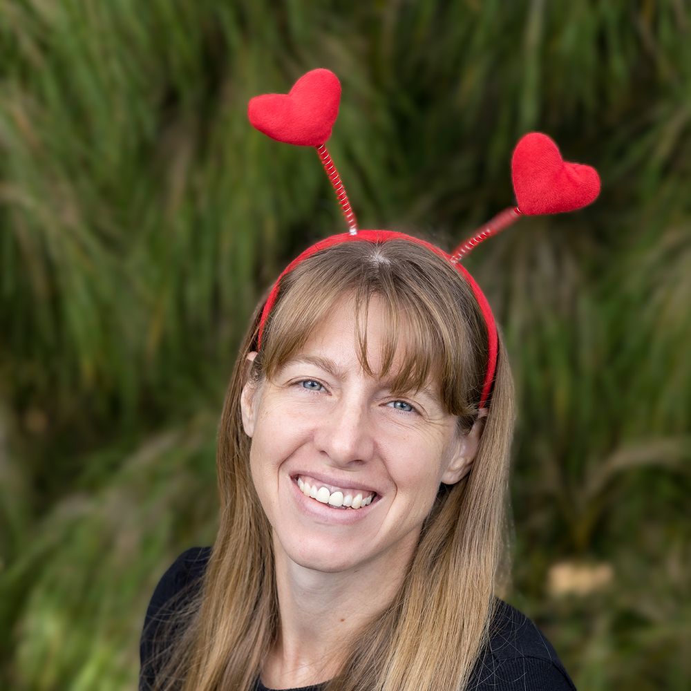 photo of photographer with red heart antennae