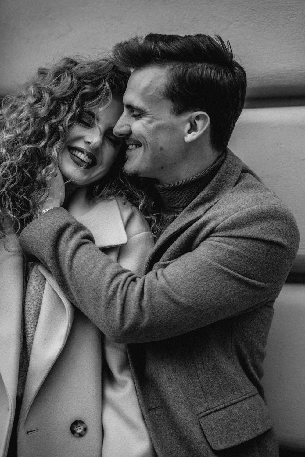 Black and white romantic portrait series showing intimate couple moments.