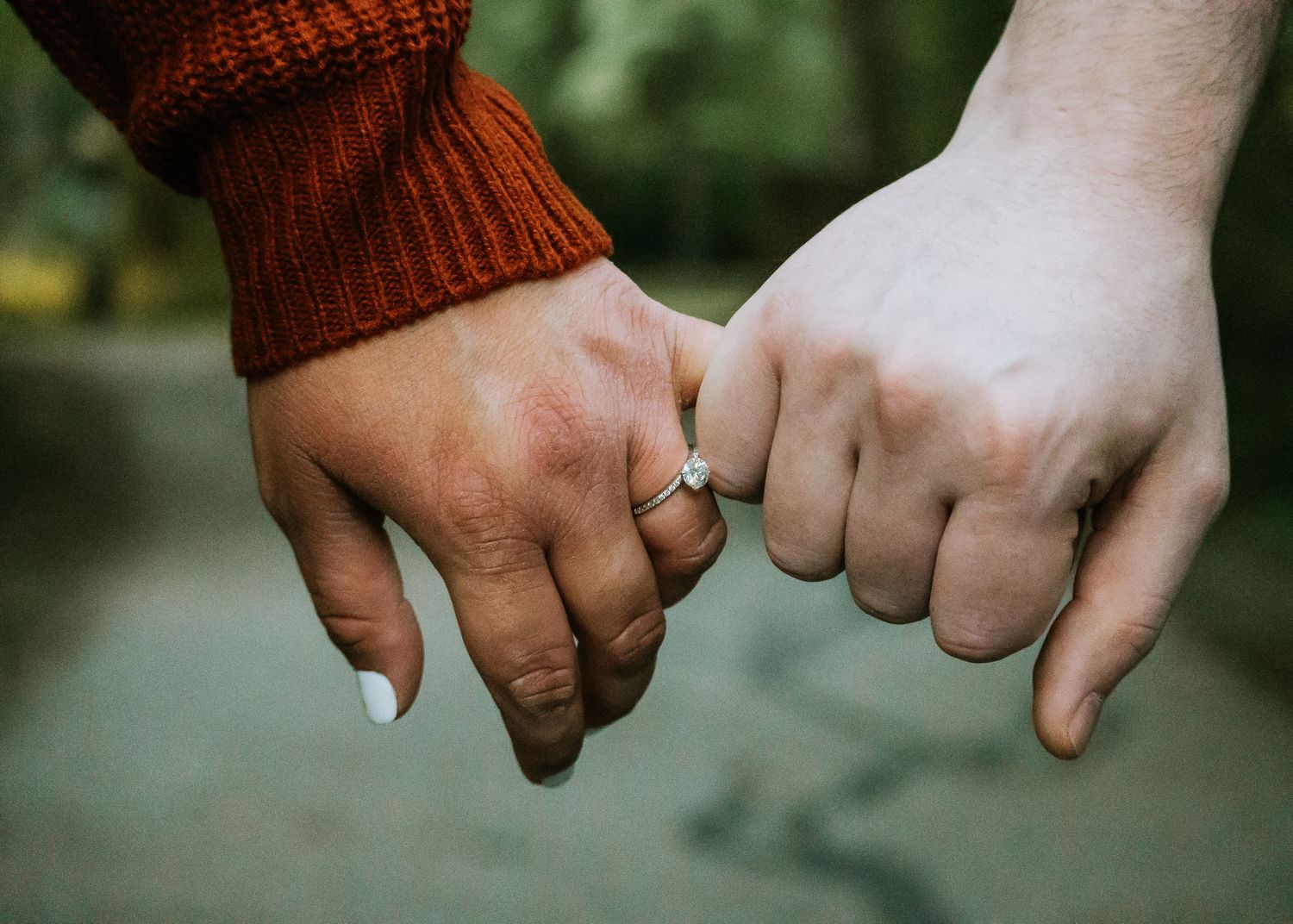 pinky promise with engagement ring