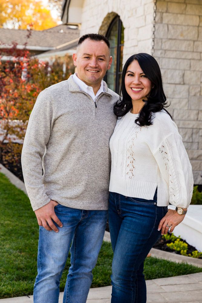 couple in front of house