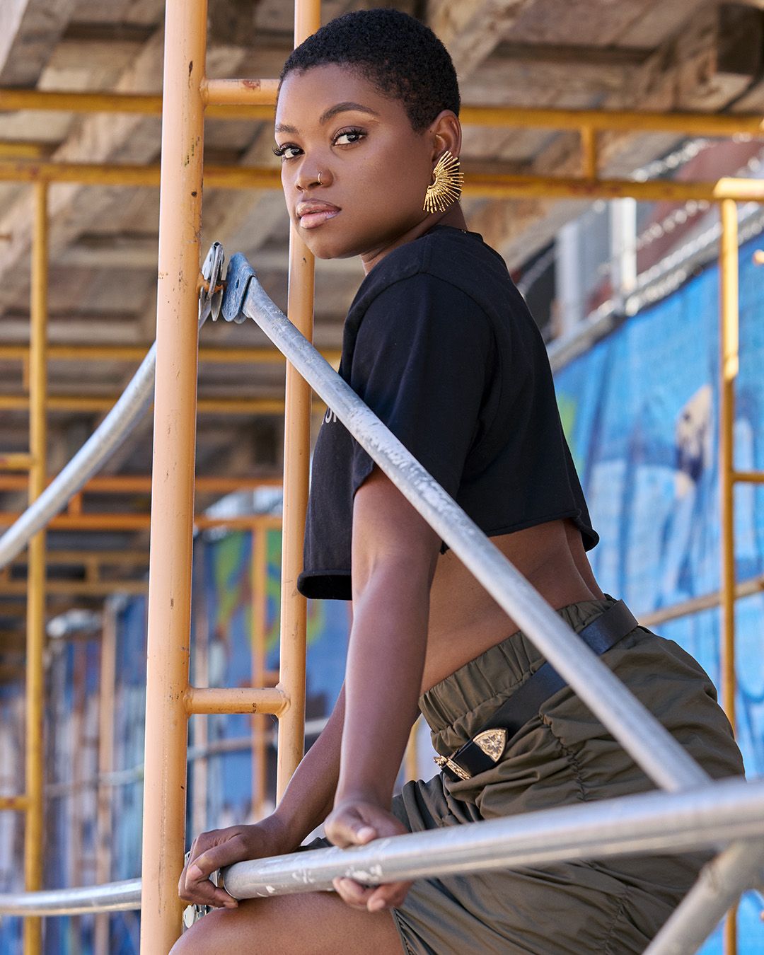 Urban fashion portrait on construction scaffolding with model Rejeanne