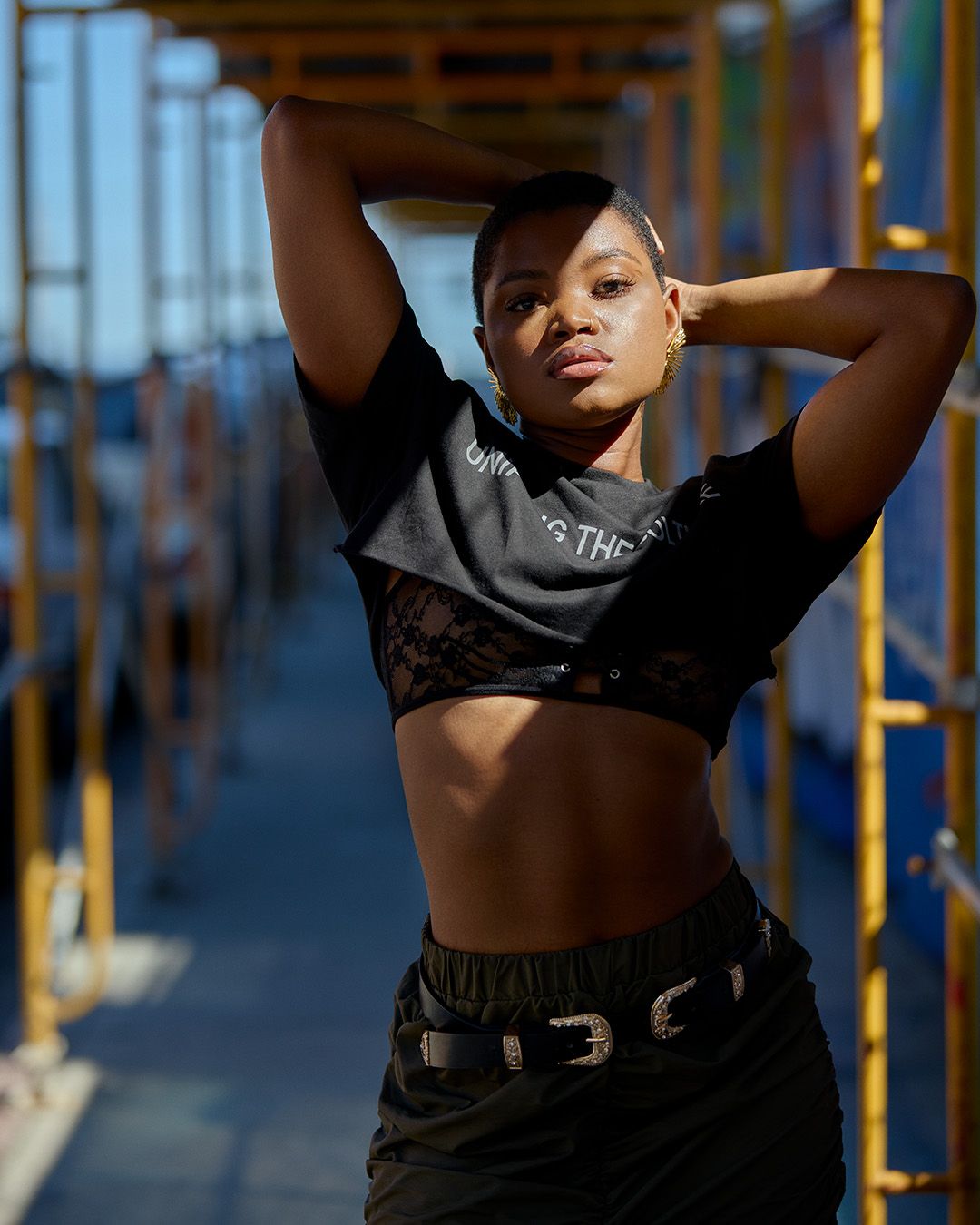 Urban fashion portrait on construction scaffolding with model Rejeanne