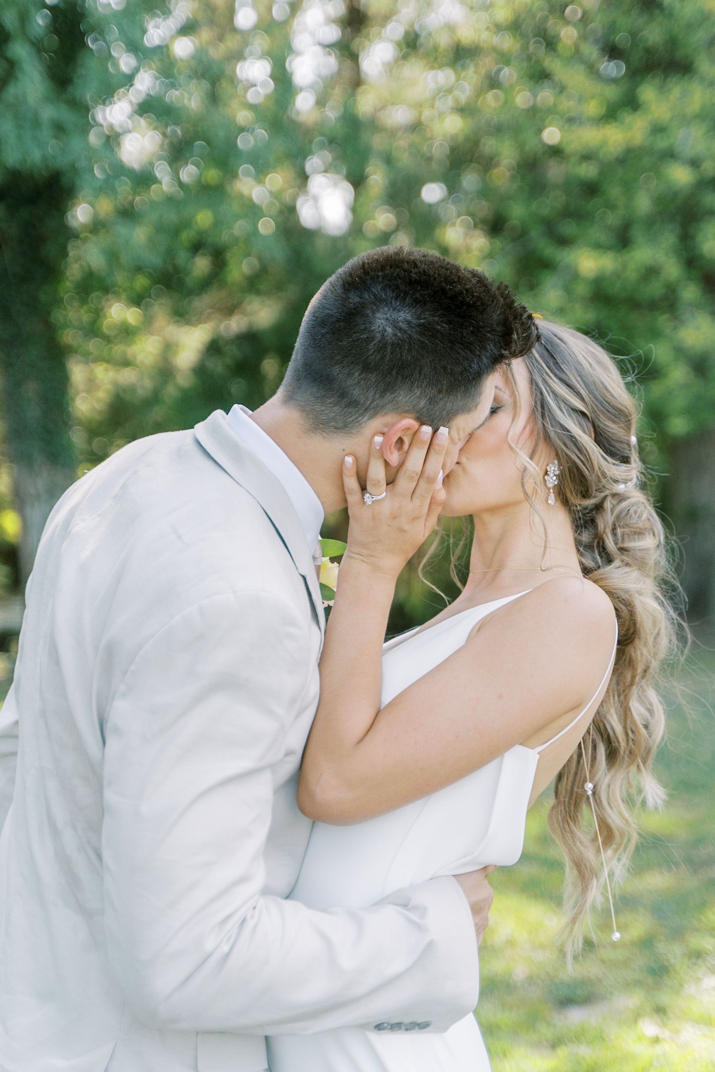A romantic outdoor wedding moment in a lush garden setting.