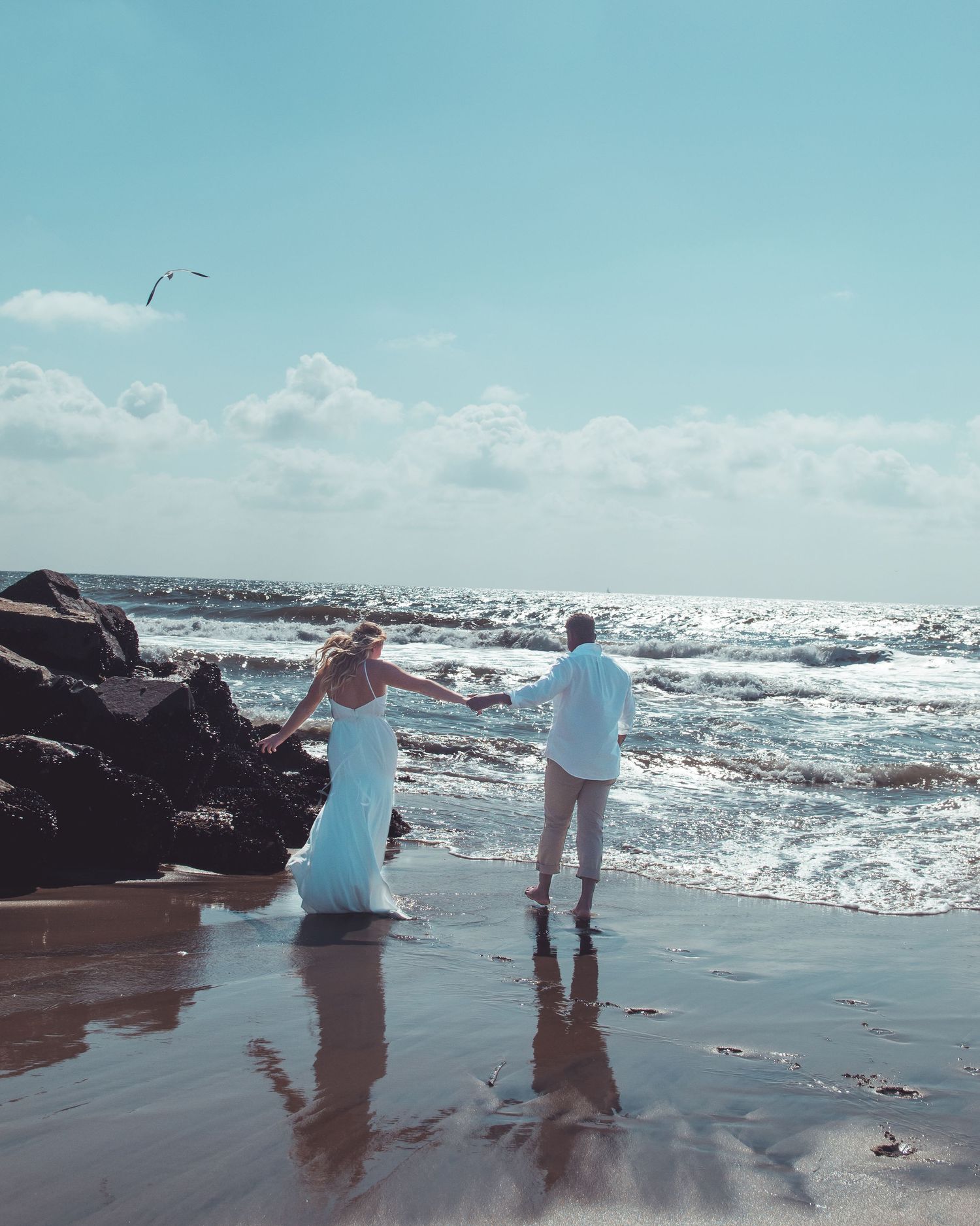 couples posing on beach in carlsbad, ca