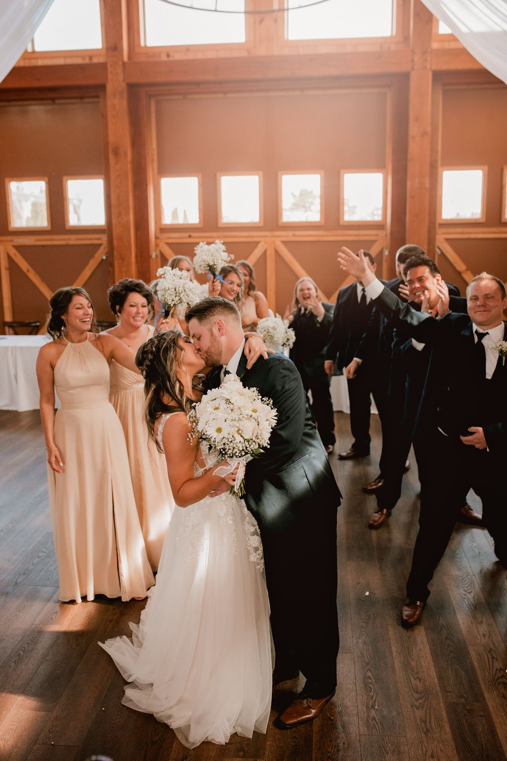 Bride and groom with their bridal party celebrating at The Barley House at Moon Town Crossing, in Springfield Missouri