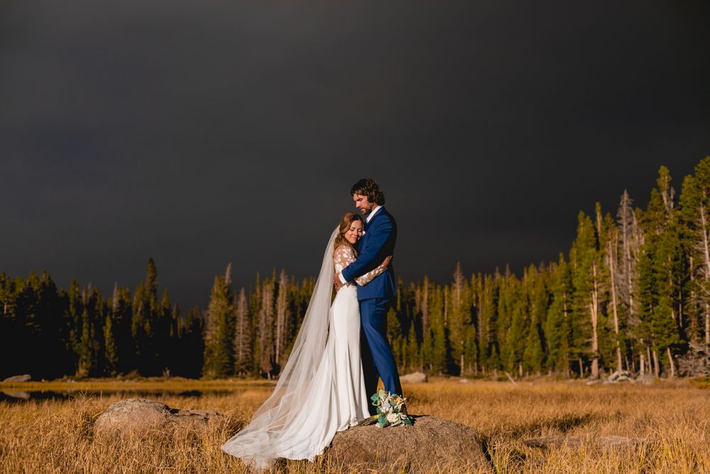 Adventurous Missouri couple eloping in Colorado, hugging on a rock, captured by Morgan Lea Photography